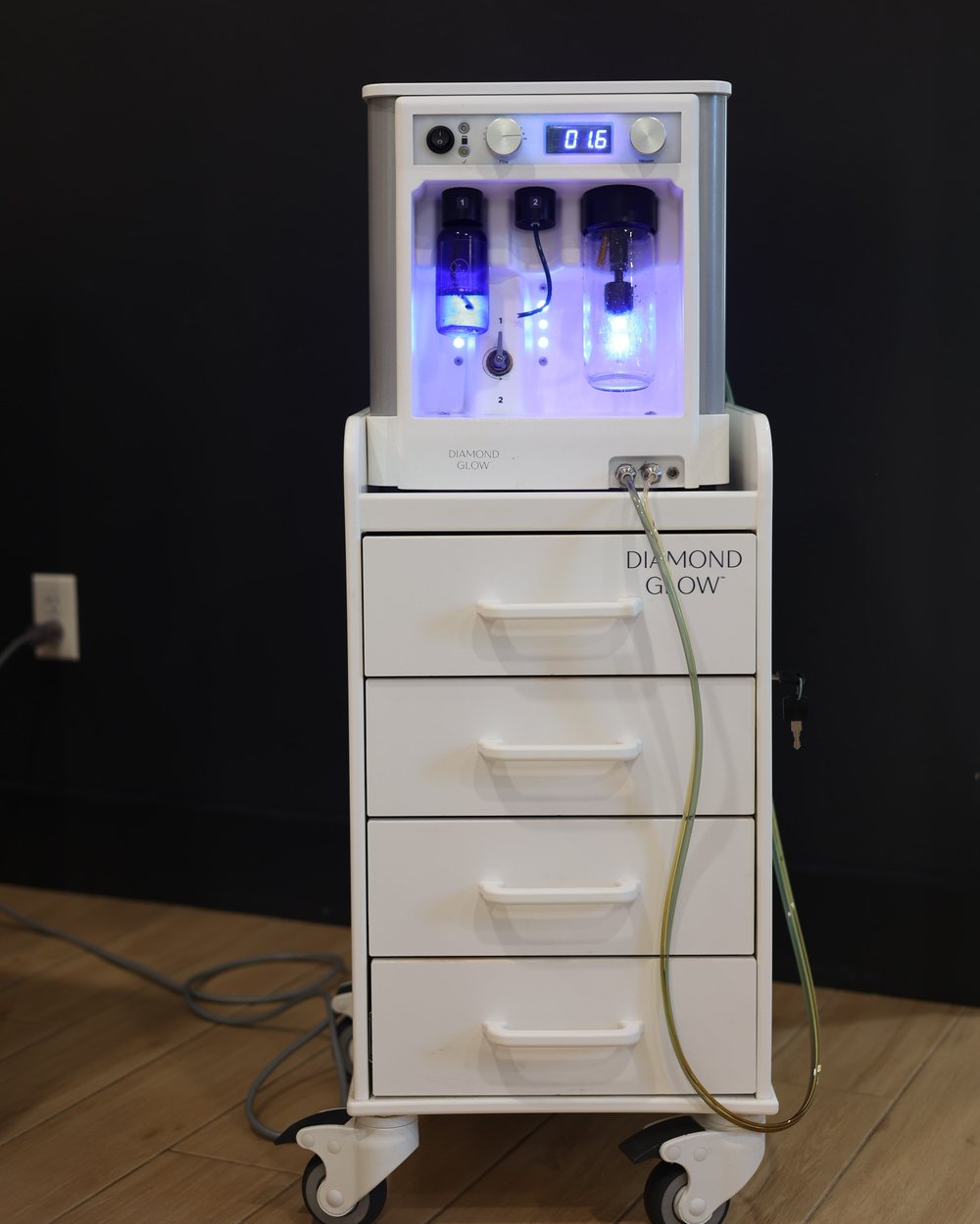 The DiamondGlow console and its serum bay in a Gudgel Aesthetics treatment room