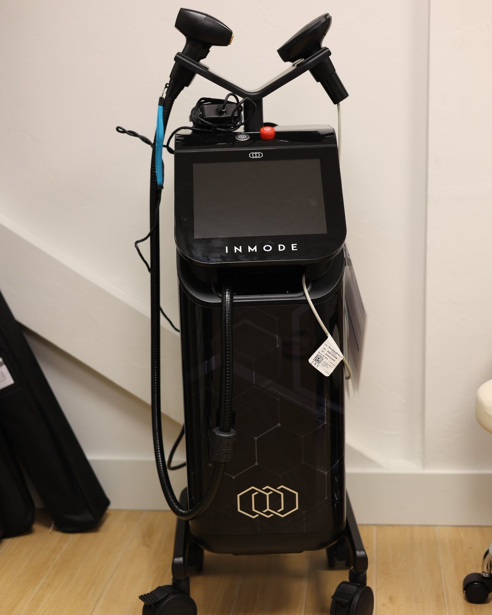 The InMode Morpheus8 workstation and its handpieces in a Gudgel Aesthetics treatment room